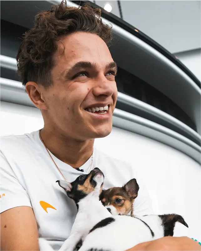 Lando holding dog smiling